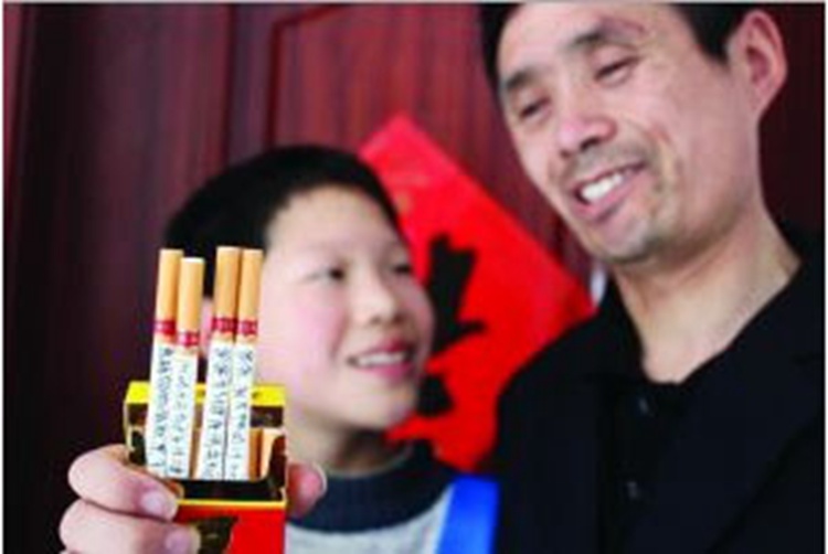 60根香烟上写满“警语” 14岁少年成功劝父戒烟【图】